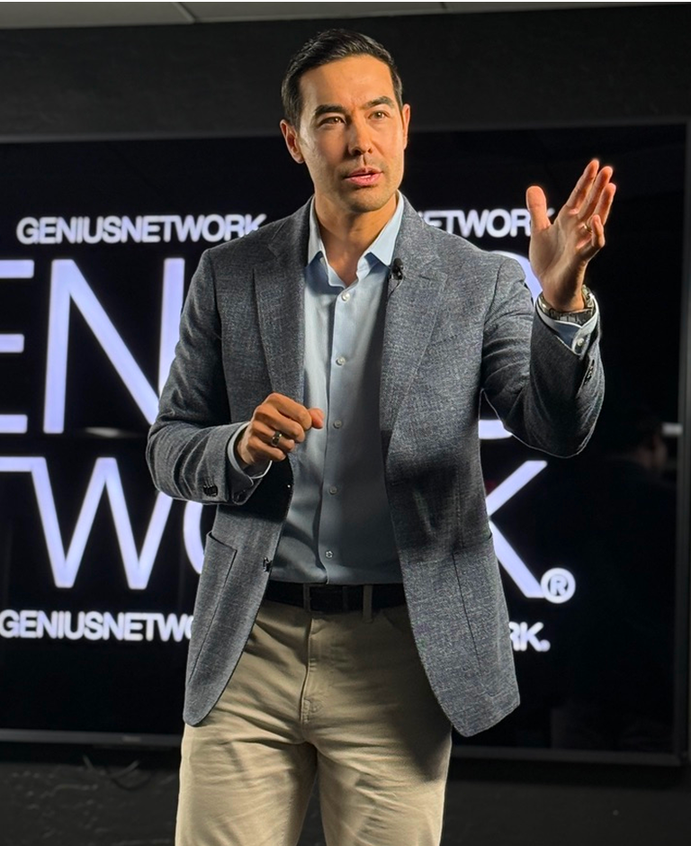 Justin ‘Hasard’ Lee speaking on stage as a corporate leadership keynote speaker