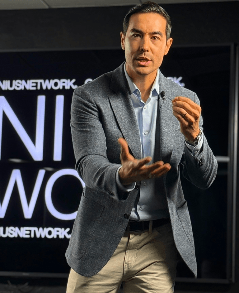 Justin ‘Hasard’ Lee speaking on stage as a corporate leadership keynote speaker